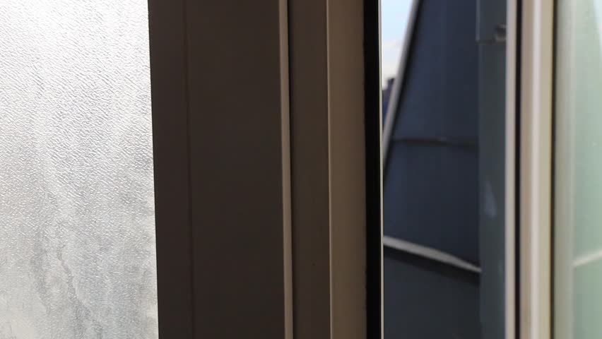 Open window overlooking the city with old buildings. Paris, France 