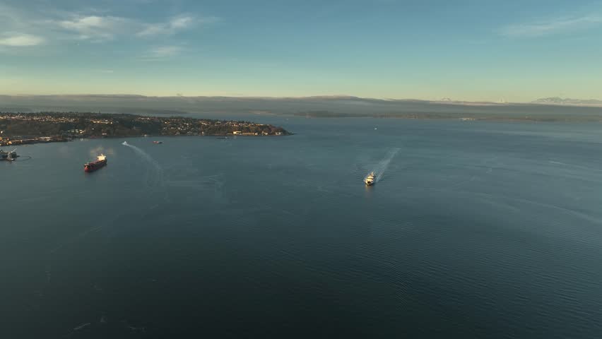 Aerial view of a passenger ferry boat sailing across Elliot Bay toward Seattle