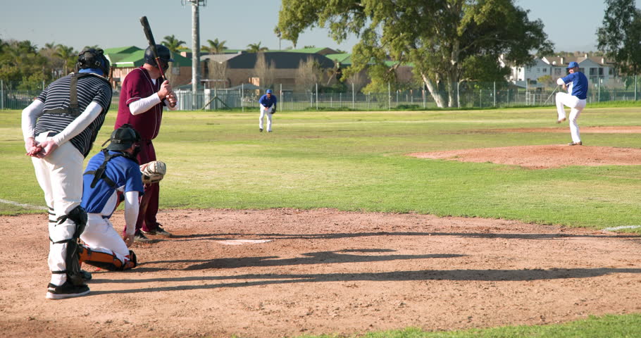 Playing baseball, batter ready to hit while catcher and umpire watch closely. sports, competition, teamwork, player, game, athletics