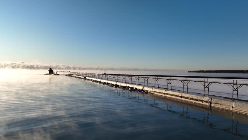 Sturgeon Bay pierhead lighthouse on a frigid Great Lakes morning in Door County Wisconsin.