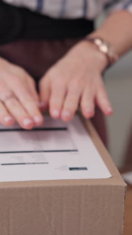 Person, hands and label with box for delivery, logistics or shipping instructions at online store. Closeup, courier or distributor with page or invoice for package, transportation or supply chain