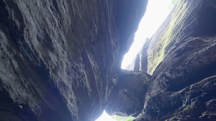 Gokarna, Karnataka, India- May 19th 2024-Tilt down shot of Yana caves in Gokarna where we see two huge rocks are stuck at the top of caves.
