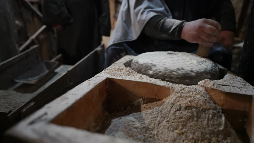 Grain Flour Production in Manual Stone Mill, Artisan Craftsmanship Reflecting Early Development Steps