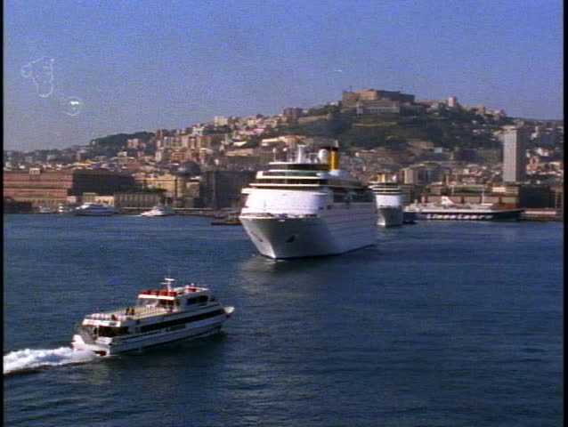 Naples, Italy, POV, moving into harbor, pass two ships