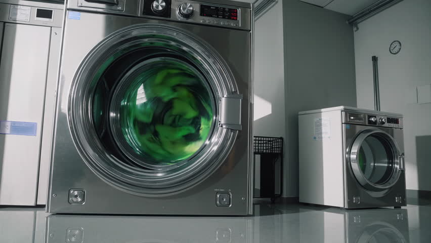 A sleek and modern laundry room that features highly efficient washing machines diligently in action