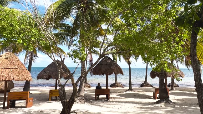 Paradise Sunny beach with palms and turquoise sea. Summer vacation and tropical beach concept - Cancun, Mexico