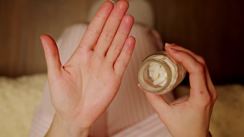 Pills and vitamins macro, Close up view of womans hands holding plenty of different drugs. Painkillers and antibiotics. Healthcare and medicine concept