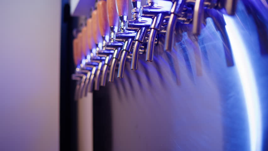 Pouring Craft Beer, Man Bartender pour lager from Tap into Pint Glass at Restaurant Bar Brewery, ipa apa