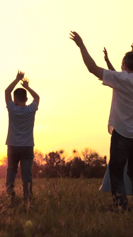 mother, father, children dancing at sunset. Happy family trip. Family car, sunset. Boy - girl dancing with dad - mom. Picnic in the open air. Brothers and sisters have fun. A childhood dream. boy