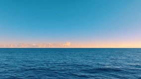 Morning sky landscape over Pacific Ocean. Sea waves at dawn. Exotic water landscape with clouds on horizon. Sunny sky and calm blue ocean. Around the world trip. Tranquility of ocean nature. - Powered by Shutterstock - Get 15% off with code: PIKWIZARD15