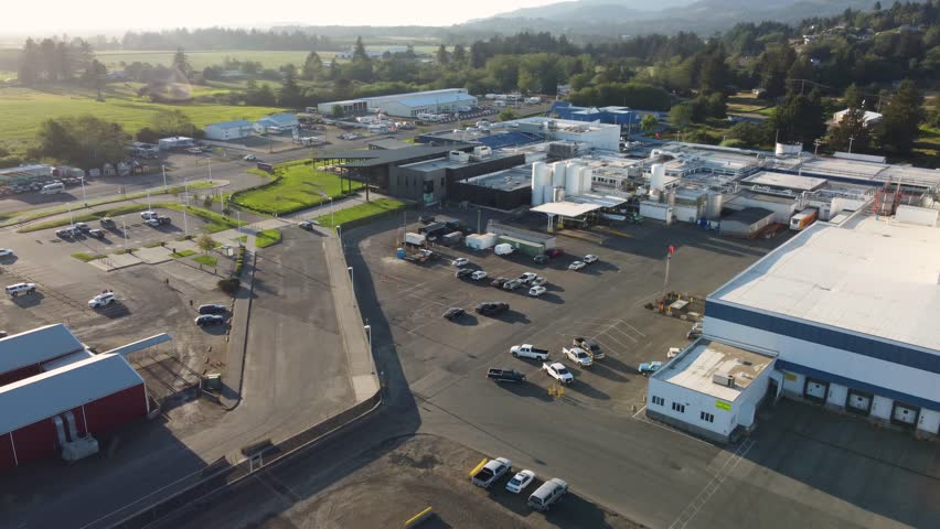Tillamook Cheese Factory, Oregon Coast Tourist Destination. Exterior Drone Shot Showing Buildings and Lot. Creamery, Gift Shop and Production Line - Packaging Plant.