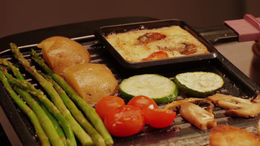 French Swiss or Spanish restaurant with traditional tapas food, Spanish cuisine, delicious tapas and cheese plate, bruschetta with cheese, olives dry tomatoes and tasty sandwich bar appetizer, buffet