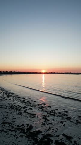 drone video above the sea with sunset