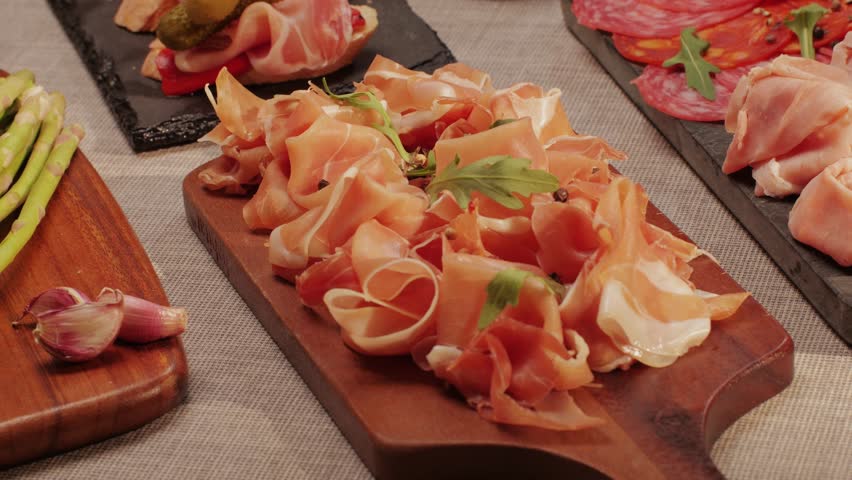 Italian or Spanish restaurant with traditional tapas food, Spanish cuisine, delicious tapas and cheese plate, bruschetta with cheese, olives dry tomatoes and tasty sandwich bar appetizer, buffet