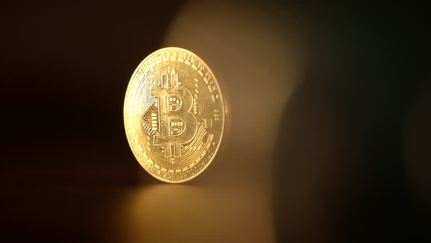 A Softly Focused Illuminated Bitcoin Coin Glowing in the Digital Currency Landscape