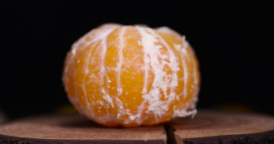 peeled orange ripe tangerines on the table, a group of peeled tangerines with juicy flesh