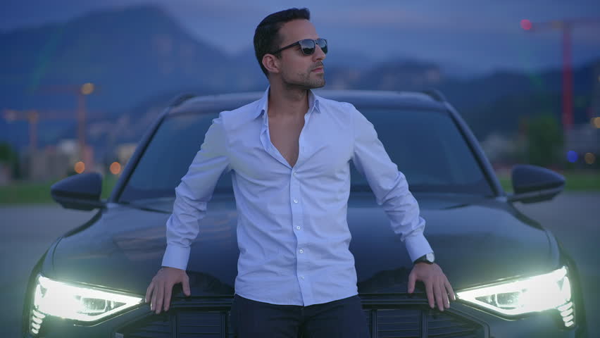 A Stylish Man Posing by a Luxury Car at Dusk, exuding confidence and charm in an urban setting