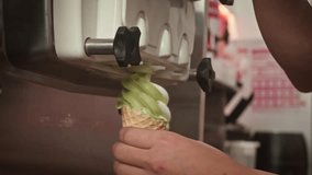 Close-up filling of wafer cup with ice cream. Ice cream in a cone. 4K. Close up whipped cream on top ice cream on a blue background. - Powered by Shutterstock - Get 15% off with code: PIKWIZARD15