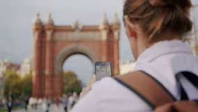 Man blogger making videos using selfie stick phone smartphone taking photo with dance for internet blog on street. Young guy tourist having video call on cellphone walking outdoors in Barcelona spain - Powered by Shutterstock - Get 15% off with code: PIKWIZARD15