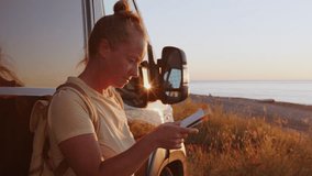 Woman using paper map while traveling in motorhome on road trip to seaside. - Powered by Shutterstock - Get 15% off with code: PIKWIZARD15
