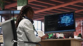 Teleworking programmer using computer for artificial intelligence computing through self learning algorithms. Remote worker working with AI deep neural networks on desktop PC, camera B - Powered by Shutterstock - Get 15% off with code: PIKWIZARD15