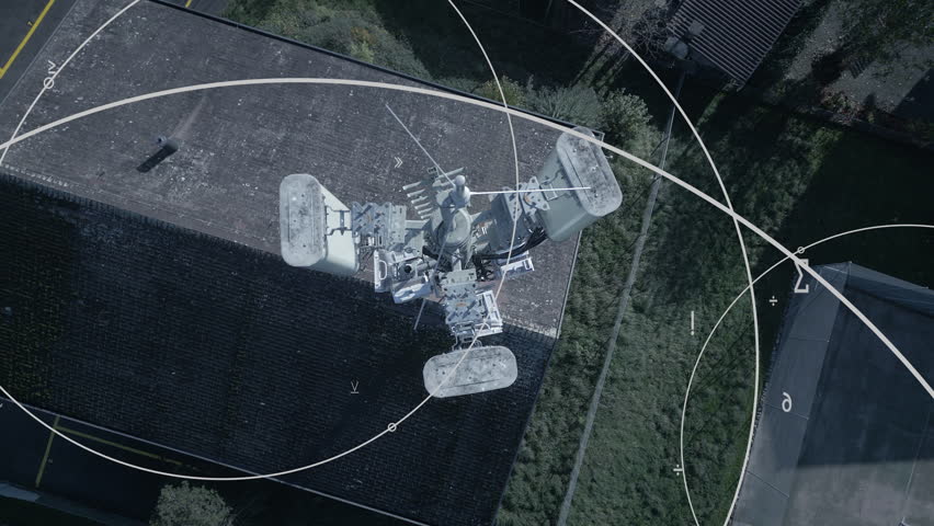 Aerial Surveillance of a Rooftop featuring Various Tech Equipment and Analysis Tools