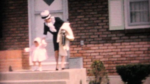 JOHNSTOWN, NEW YORK, 1964: A mother and daughter model their new Easter dresses in front of their home in 1964.