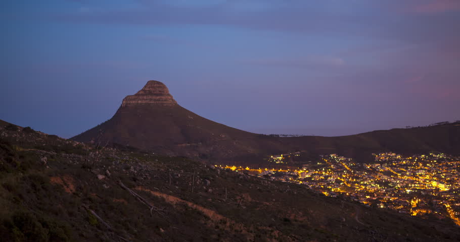 A static Time Lapse of sunrise in Cape Town including Lions Head and the City Suburb light change in the early morning.
