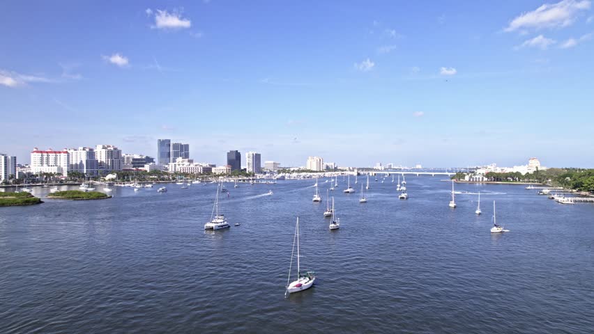 Push in drone shot of many boats on Lake Worth Lagoon in West Palm Beach, Florida, USA