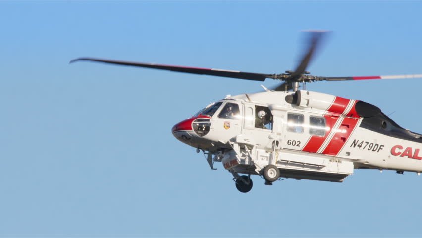 In January 7, 8, 9, 2025, helicopters battle a massive fire in Malibu, Los Angeles. This dramatic event is shown in slow motion, highlighting the intensity and urgency, creating a lasting impression