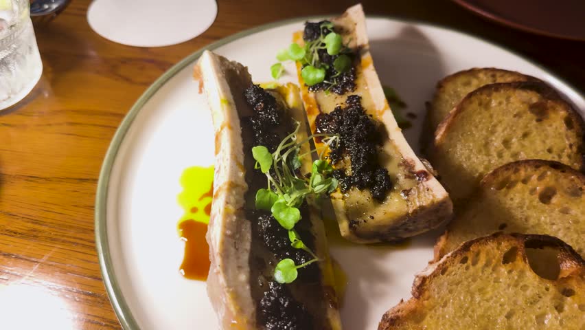 Bone marrow served with toast and garnish