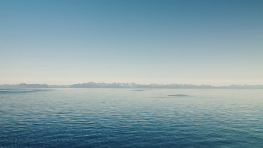 Open sea with a view of a mountain range of Lofoten in Norway