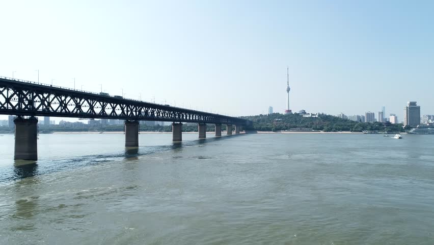An aerial view of the Wuhan Yangtze River Bridge spanning the Yangtze River, showcasing the bridge