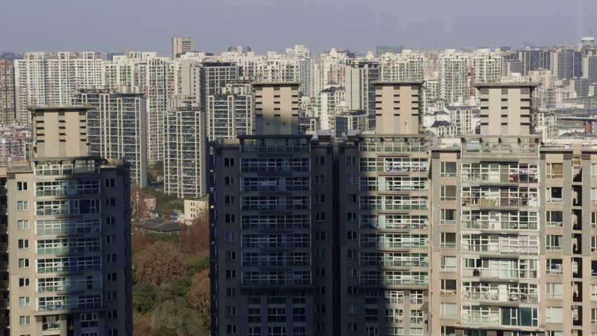 Urban Cityscape of Shanghai Downtown
A dense urban scene of Shanghai’s high-rise buildings stretching across the city.