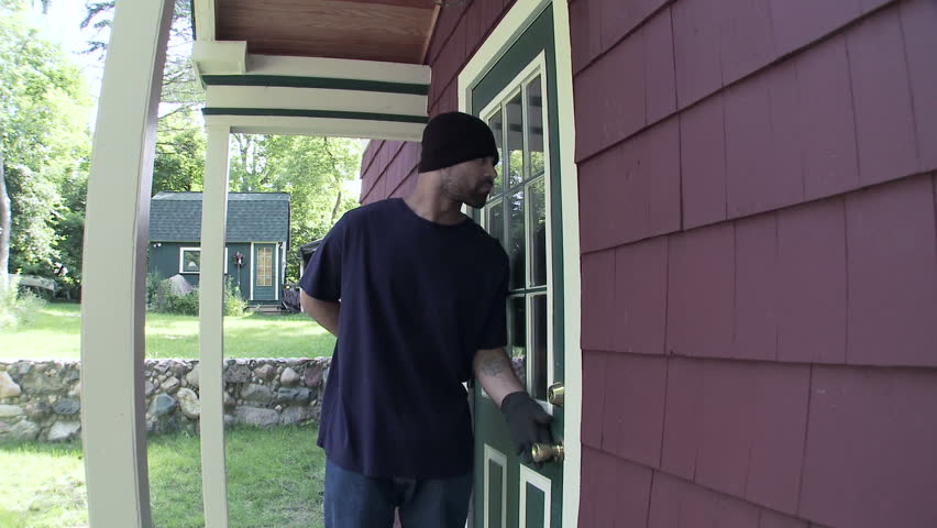 Burglar makes his way up to a house door, finds it unlocked and makes his way