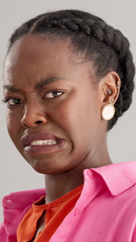 Black woman, face and disgust with negative emotion, nasty odor and gross smell. African person, unhappy and annoyed on gray background as cringe, stink and frustrated with reaction and expression