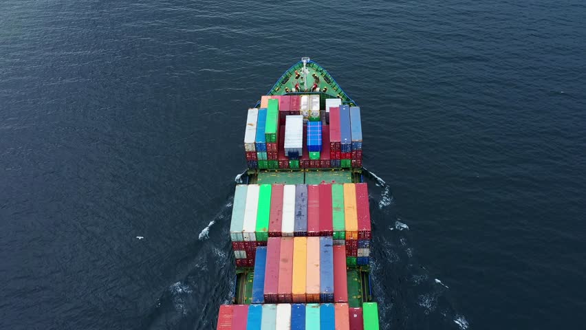 Top down view of a large container ship in sea. Logistics and transport