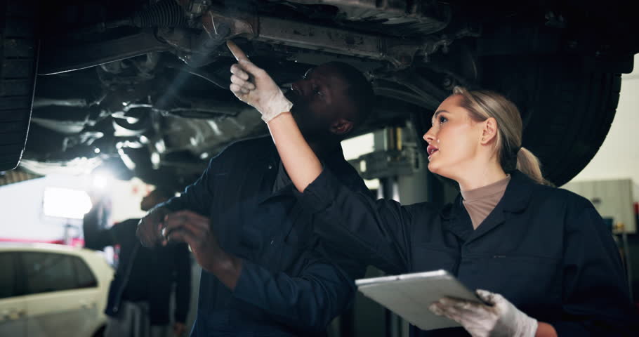 Garage, mechanic and manager with tablet for inspection, diagnostic test and teamwork for calibration. Repair shop, supervisor and car technician with spanner tool for fixing, maintenance and check