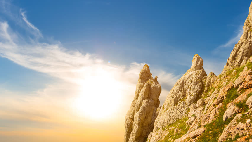 rocky mount slope at the dramatic sunset, natural mountinering time lapse scene