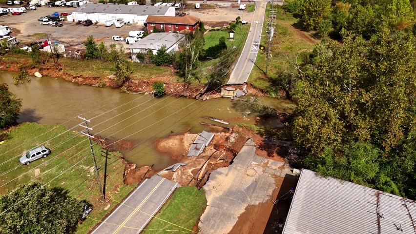 Cinematic drone shot of bridge washed out by Hurricane Helene. Swannanoa, NC - Asheville area.