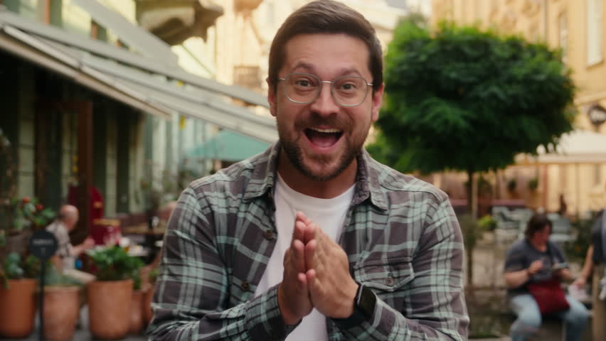 Happy man Caucasian male guy businessman traveler excited surprised tourist portrait outdoors looking at camera shock open mouth amazing news celebrate win travel tour holiday city emotions astonish