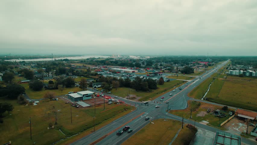 Aerial View of Southwest New Orleans Cityscape and Busy Highways Under Overcast Skies