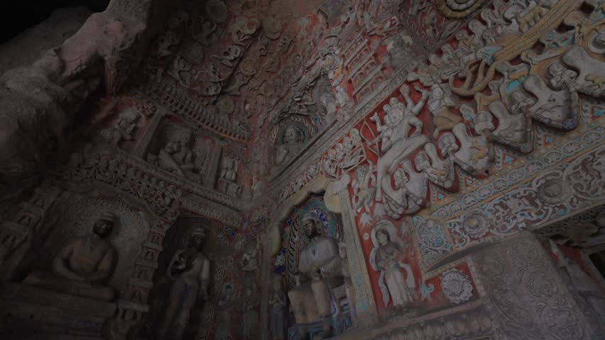 The Yungang Grottoes in Datong, Shanxi Province, China, were originally built 1500 years ago during the Northern Wei Dynasty, featuring huge and exquisite Buddha sculptures