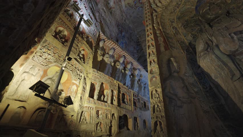 The Yungang Grottoes in Datong, Shanxi Province, China, were originally built 1500 years ago during the Northern Wei Dynasty, featuring huge and exquisite Buddha sculptures
