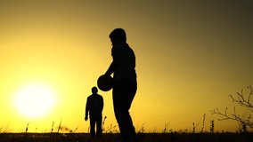 Boy child goalkeeper dad kicks ball, goal. Child son play football with father on lawn. Family team, sports games. Active happy family. Son dad having fun playing ball on green grass. Family kid sport - Powered by Shutterstock - Get 15% off with code: PIKWIZARD15