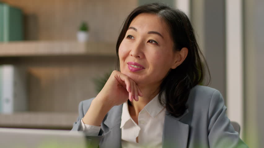Dreaming Asian businesswoman thoughtful smiling girl Chinese Korean business woman Japanese female thinking alone in office inspired adult employer manager dream think wish ponder looking idea plan