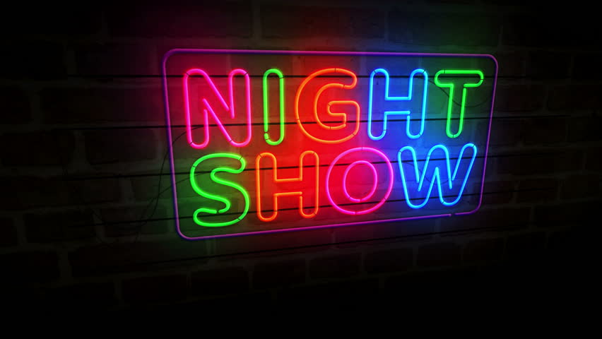 Show time event neon symbol on brick wall. Showtime entertainment light color bulbs abstract concept.