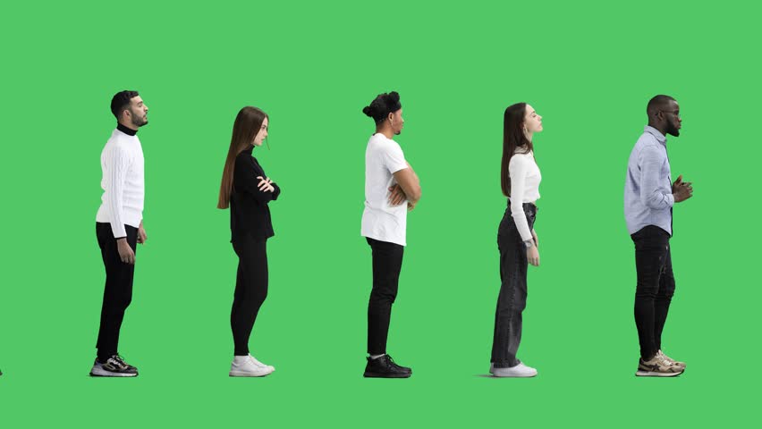 A full-length group of people on a green background are standing in line