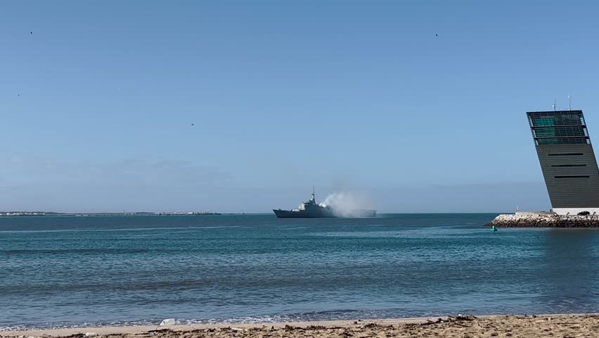 Navy military ship in Atlantic Ocean Portugal coast guard, view from beach