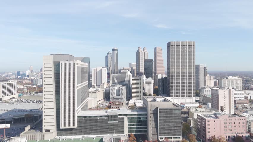 Aerial view of downtown Atlanta, Georgia, showcasing a vibrant skyline with tall skyscrapers, modern architecture, and urban development.